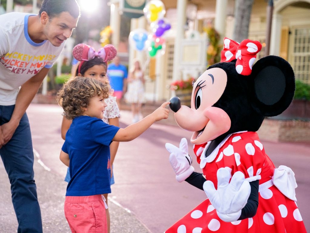 Boy with Minnie Mouse at Disney